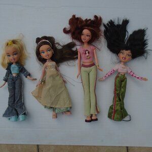 Lot of 4 Fashion Dolls Various Sizes Dressed